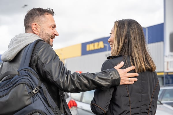 Two people in the carpark of an IKEA