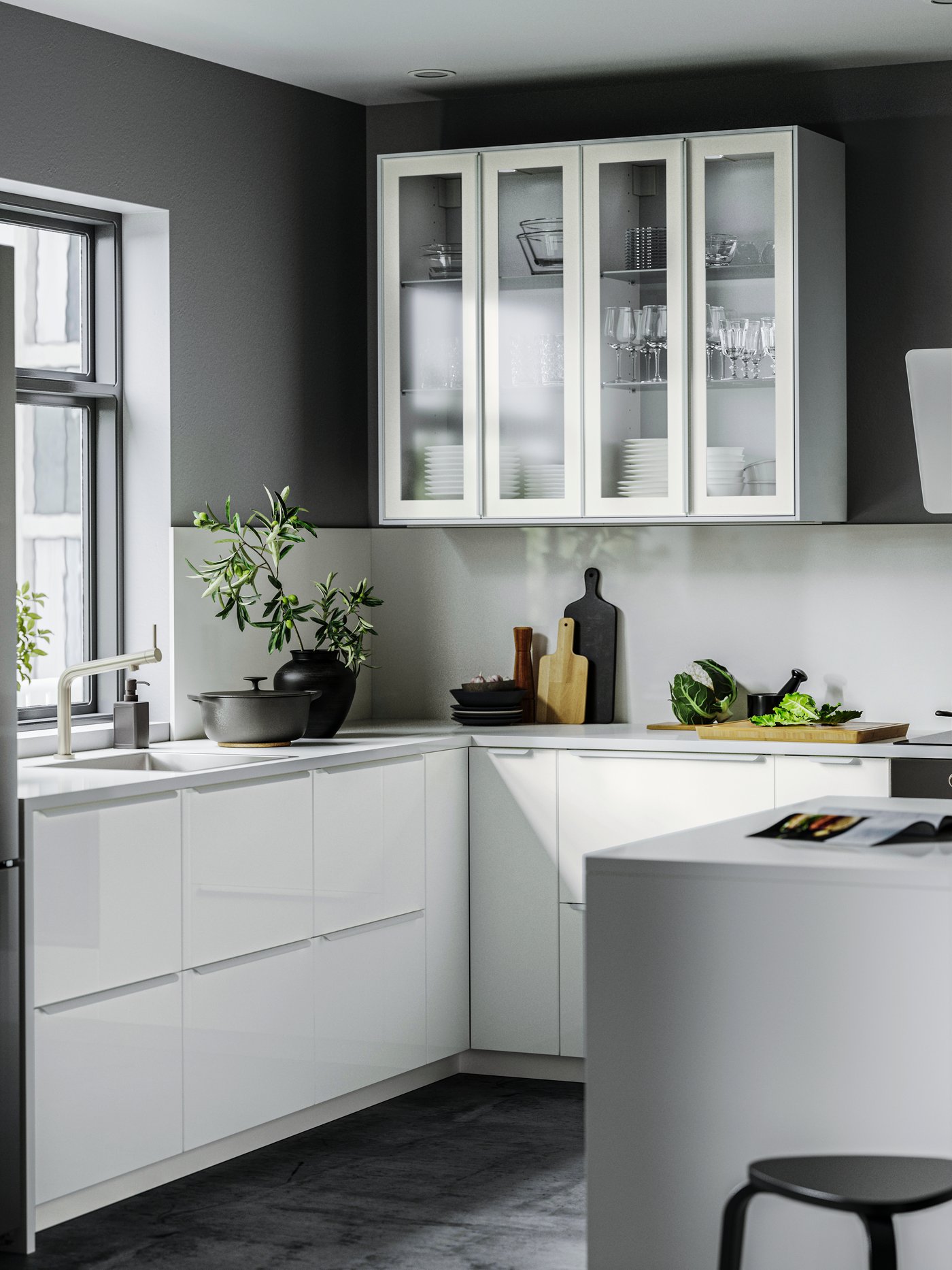 A high-gloss white/laminate SIBBARP custom made wall panel in the kitchen