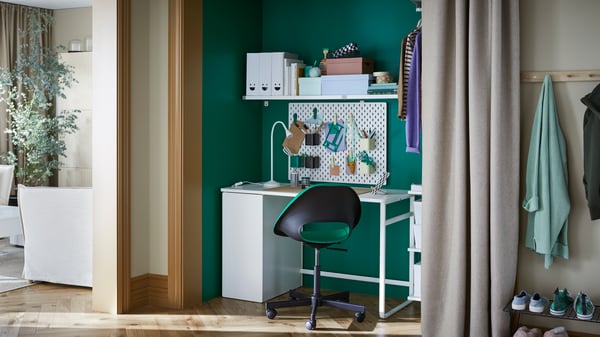 A white LÄRANDE desk with pull-out storage unit