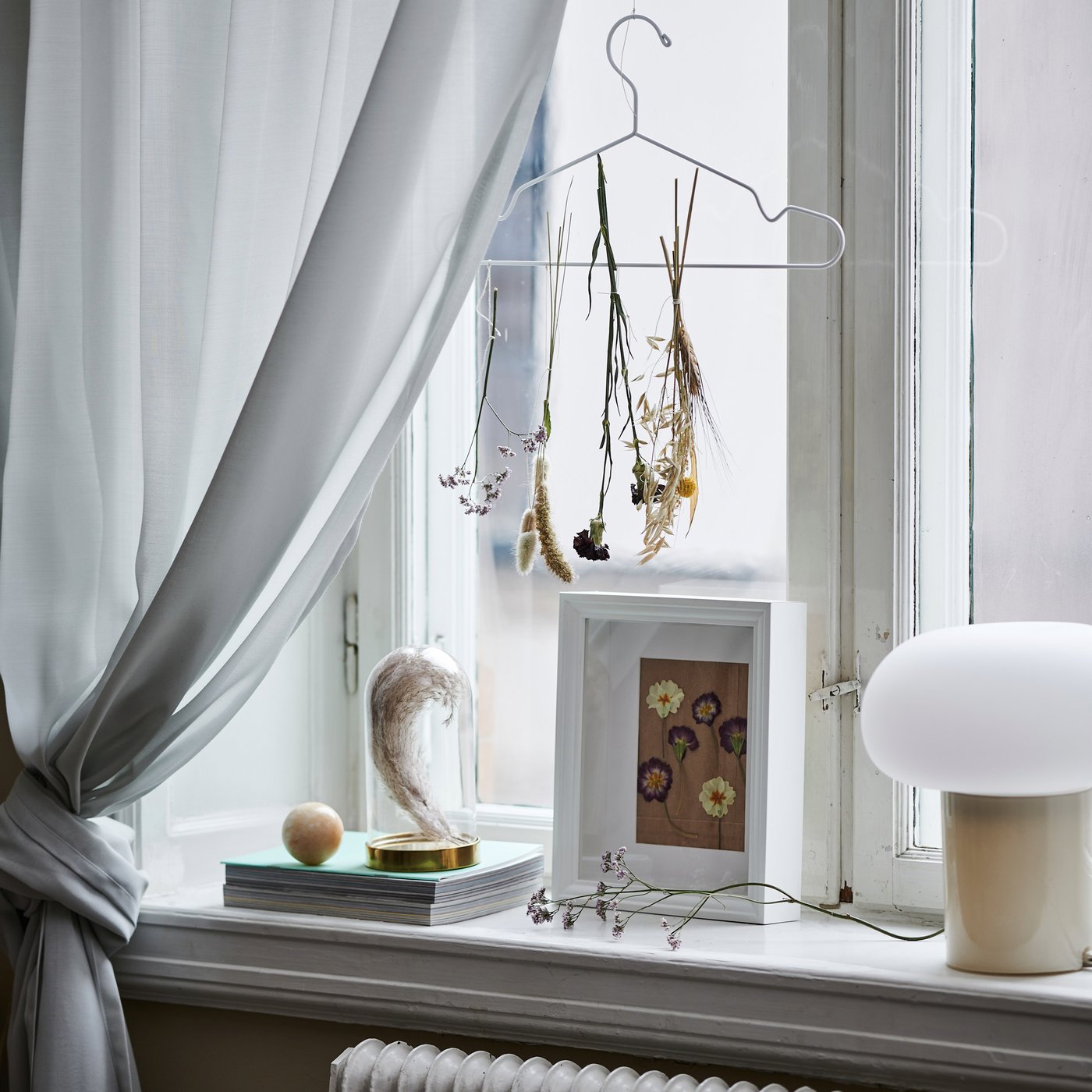 A beige/opal white glass DEJSA table lamp in the living room