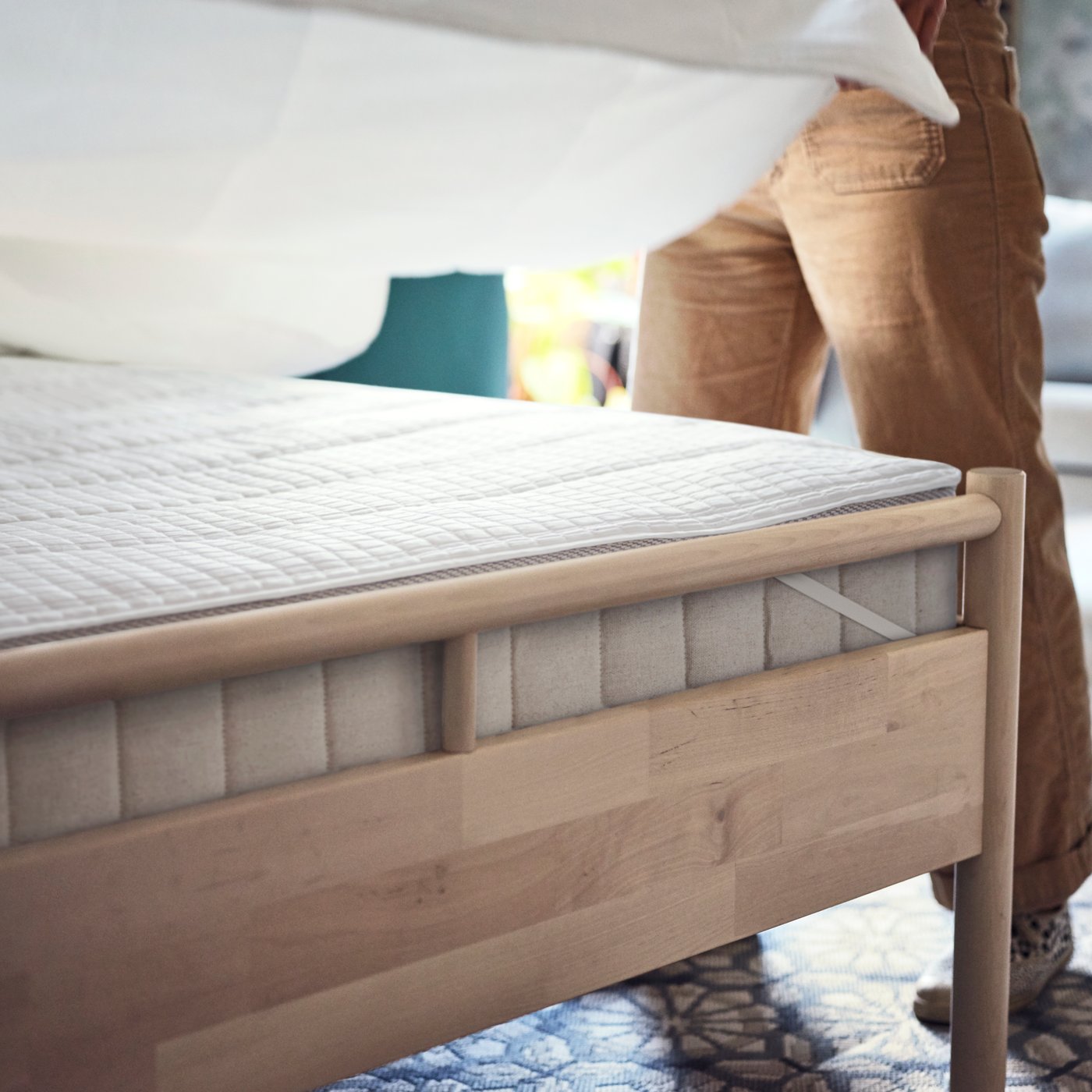 A grey/beige HUNDSLUND rug flatwoven, in/outdoor in the bedroom