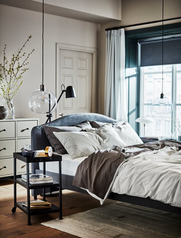 Room setting with chair, plants and cuurtains