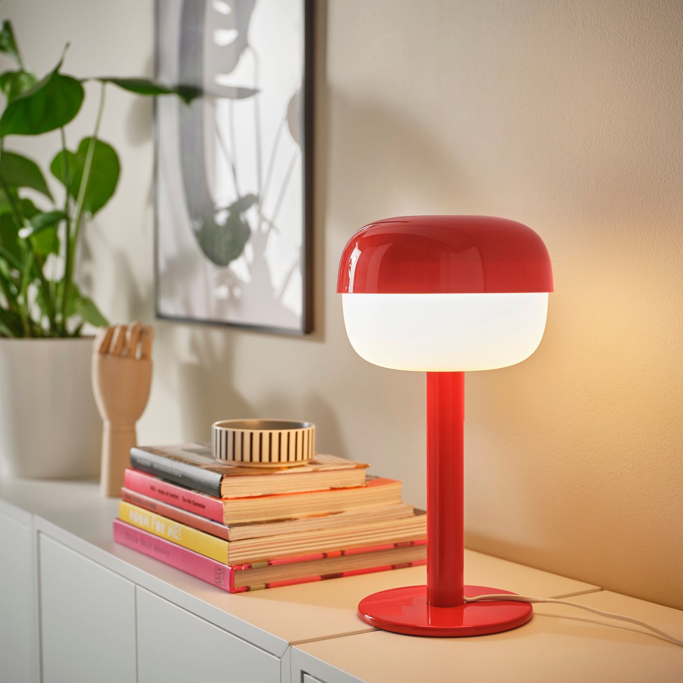 A red BLÅSVERK table lamp