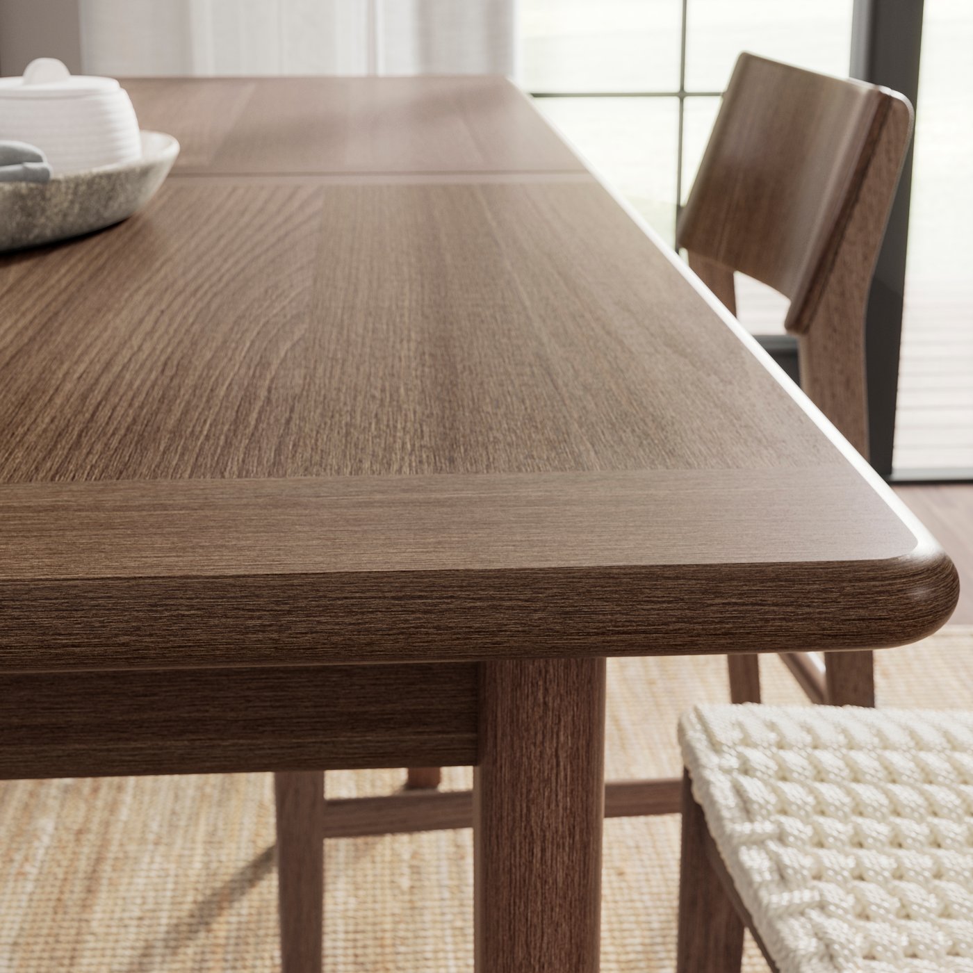 A brown beech/veneer SKANSNÄS extendable table in the NA
