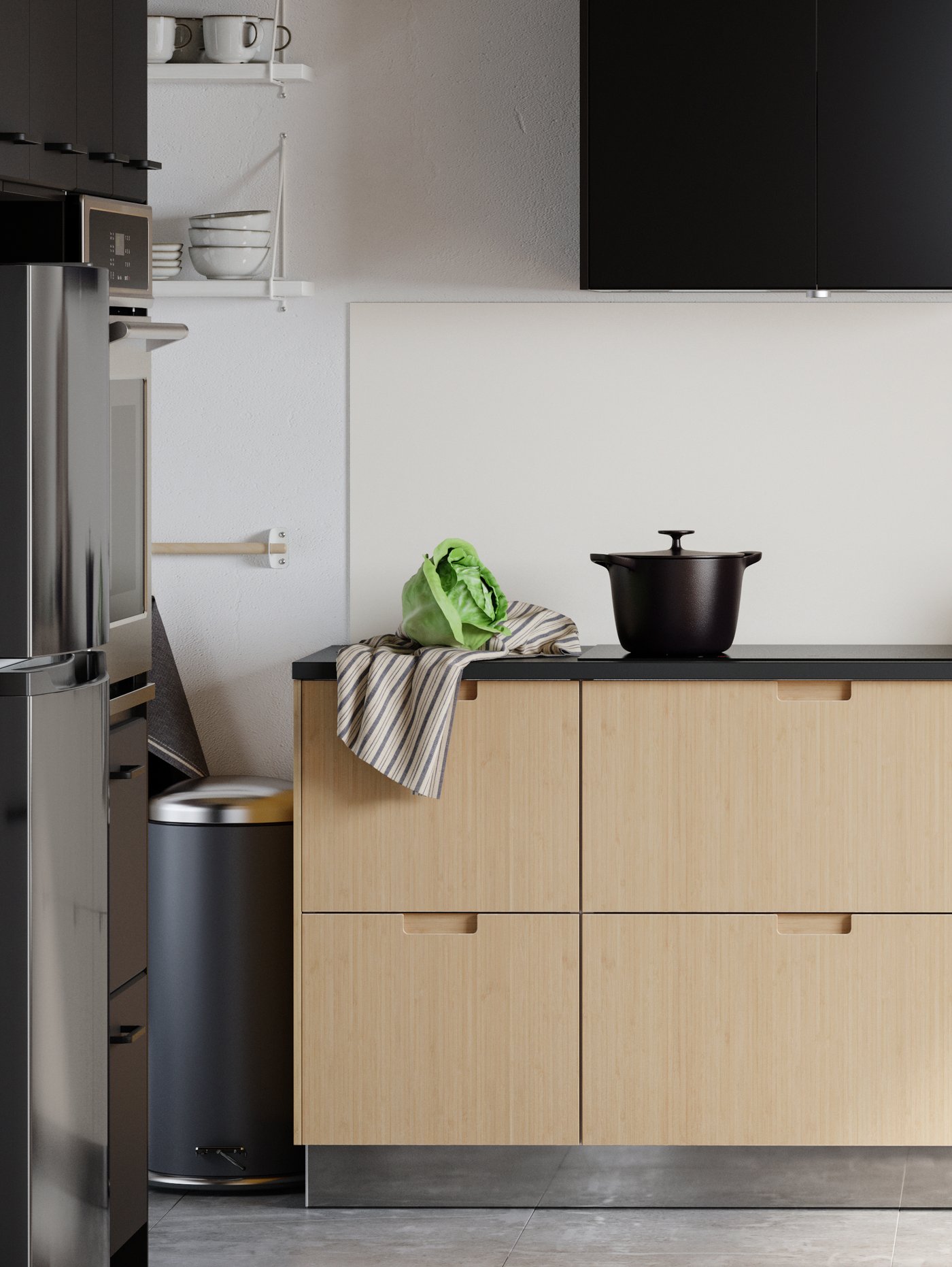 A minimalist kitchen with light bamboo drawer fronts, black doors, a light bamboo dining table and two chairs.