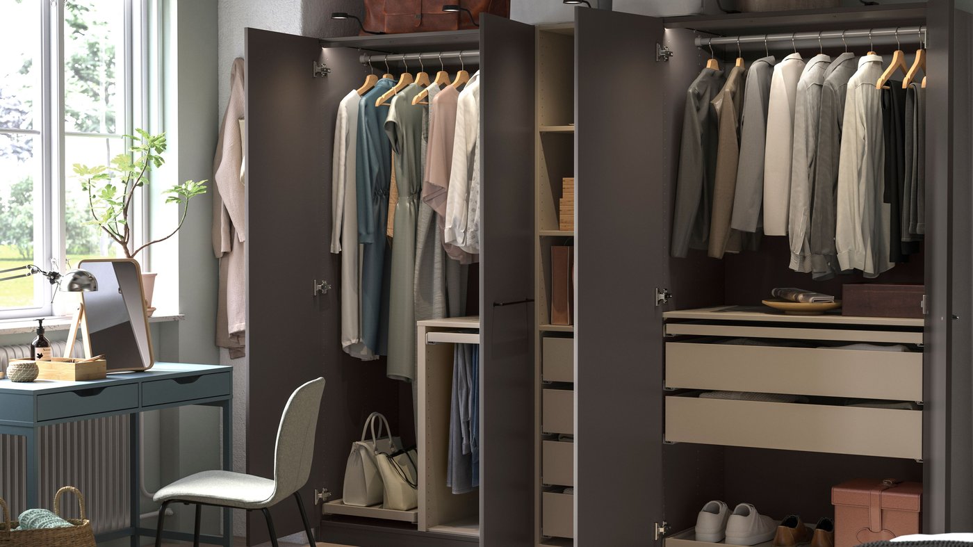 A dark grey grey-beige/dark grey PAX wardrobe combination in the bedroom