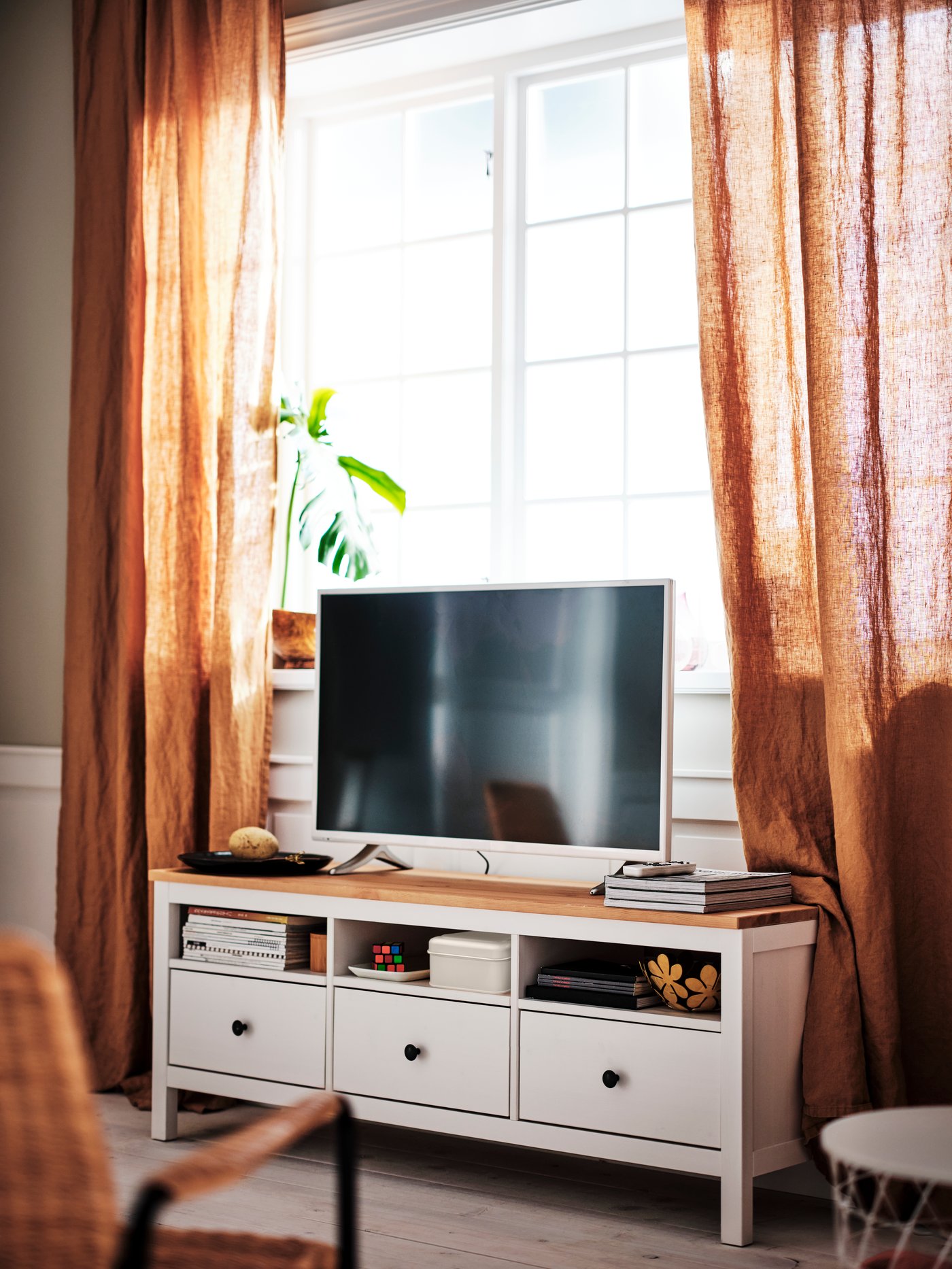 A white KVISTBRO storage table in the living room