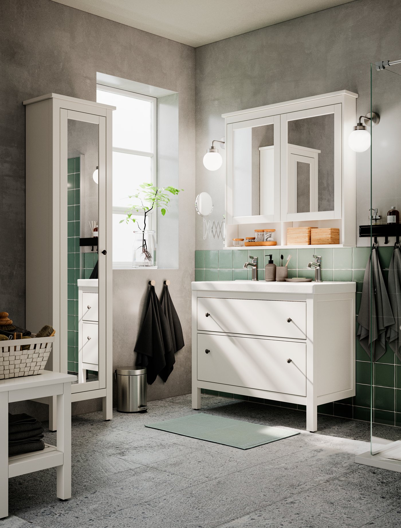 A light grey-green ALSTERN bath mat in the bathroom