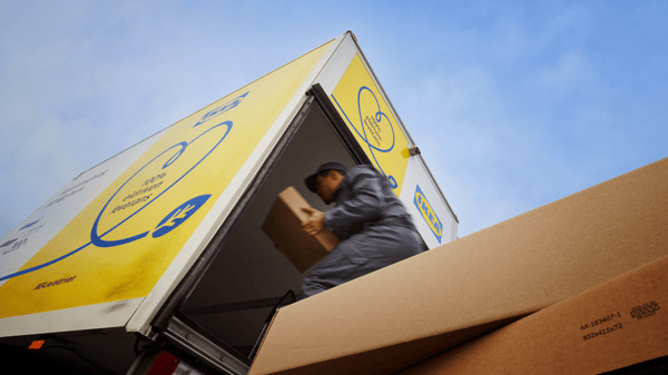 An IKEA delivery man unloading a truck.