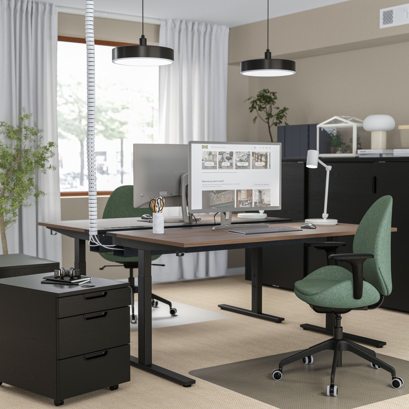 A black stained ash veneer GALANT drawer unit on castors in the home office