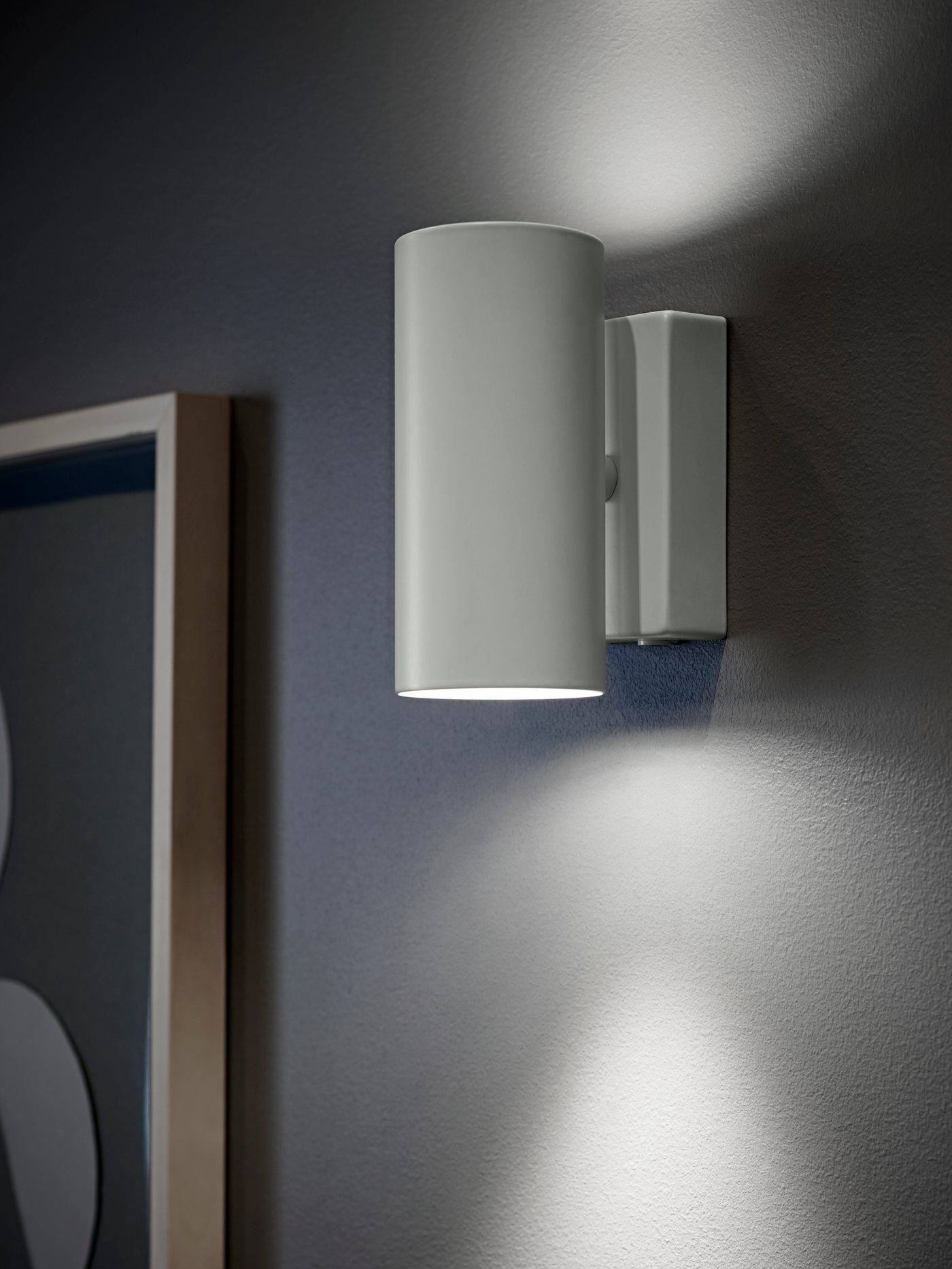 A white NYMÅNE wall up/downlighter, wired-in