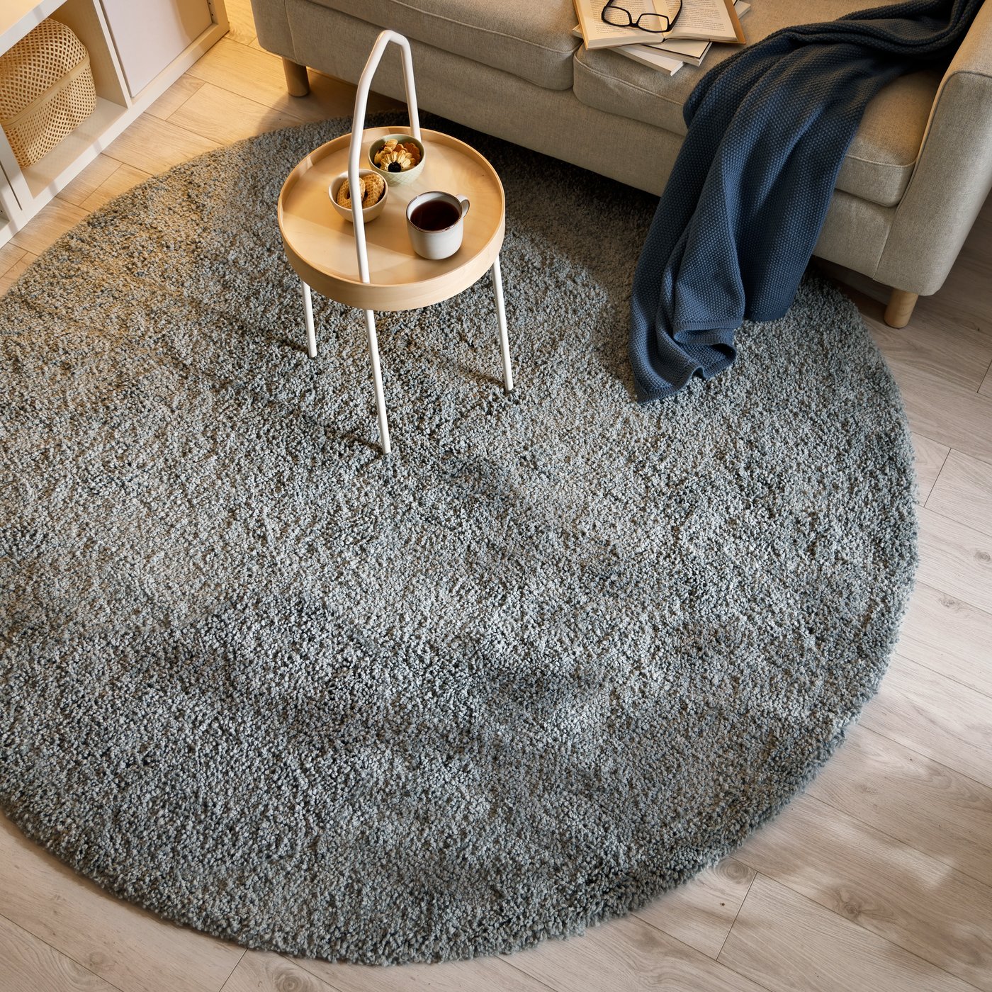 A medium grey STOENSE rug, low pile in the living room
