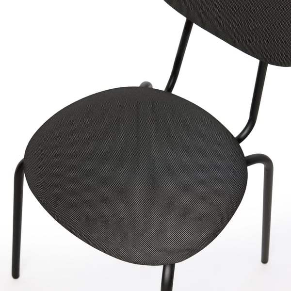 A top-down view on the padded seat of a black ÖSTANÖ chair.