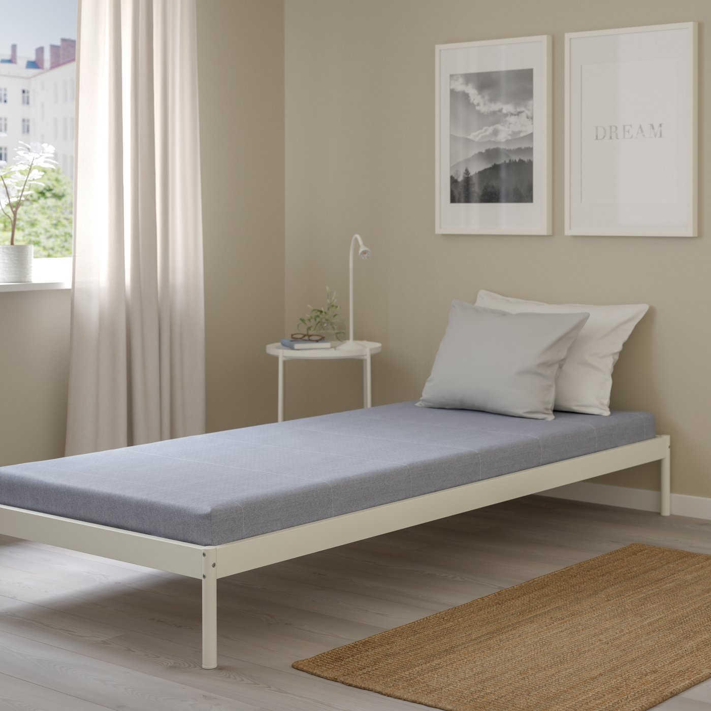 A firm/light blue ÅGOTNES foam mattress