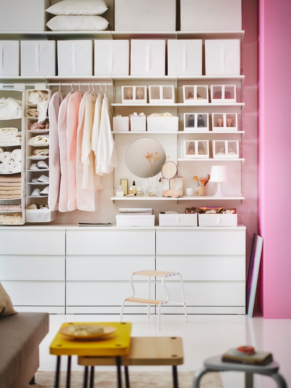 A white SKUBB storage with 9 compartments in the bedroom