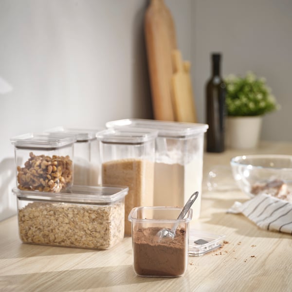 A transparent KORALLVIPPA dry food jar with lid
