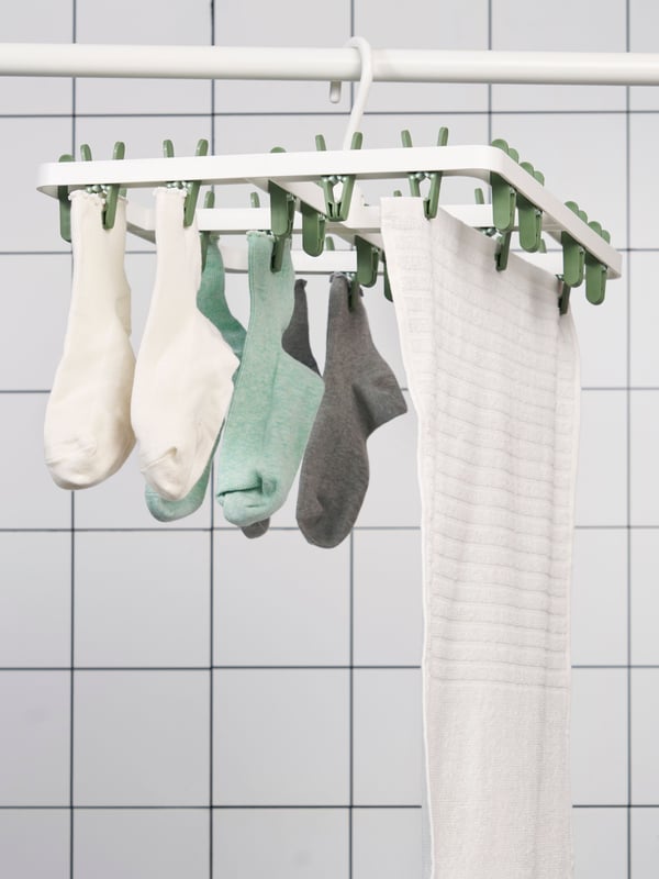 A green SLIBB hang dryer 24 clothes pegs
