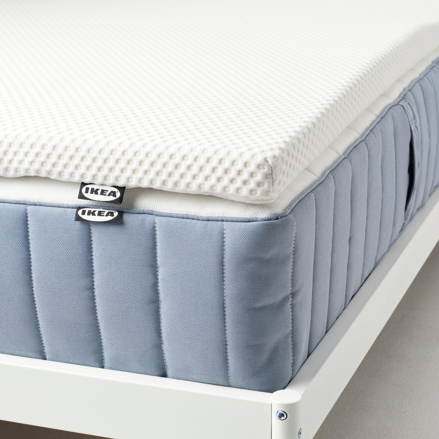 A white NORDBERGET mattress pad