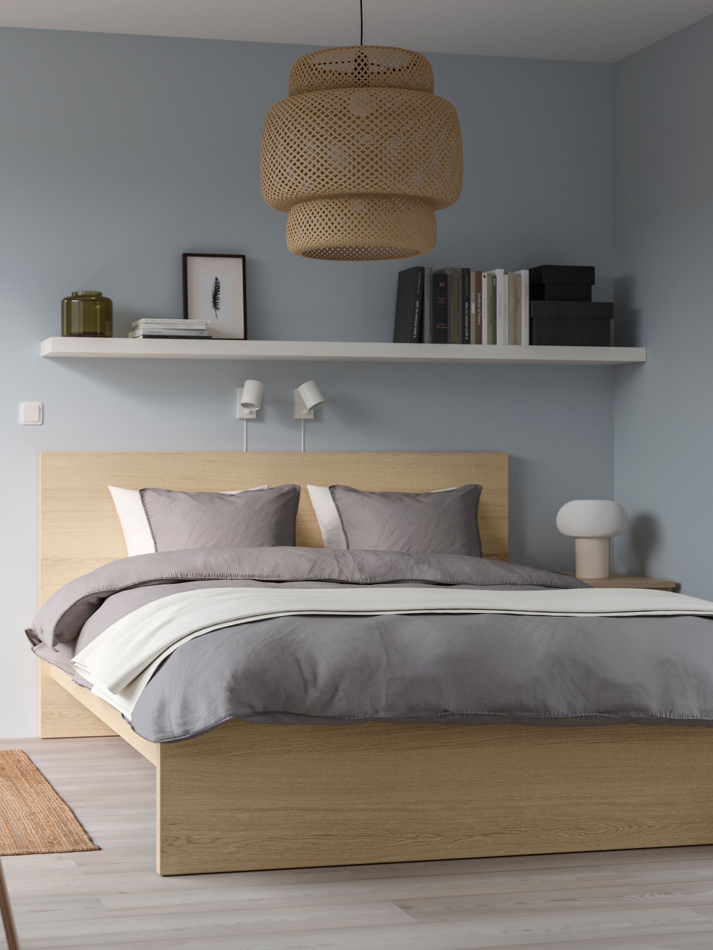 A bamboo/handmade SINNERLIG pendant lamp in the bedroom
