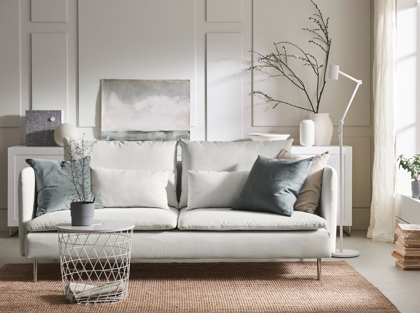 A white KVISTBRO storage table in the living room