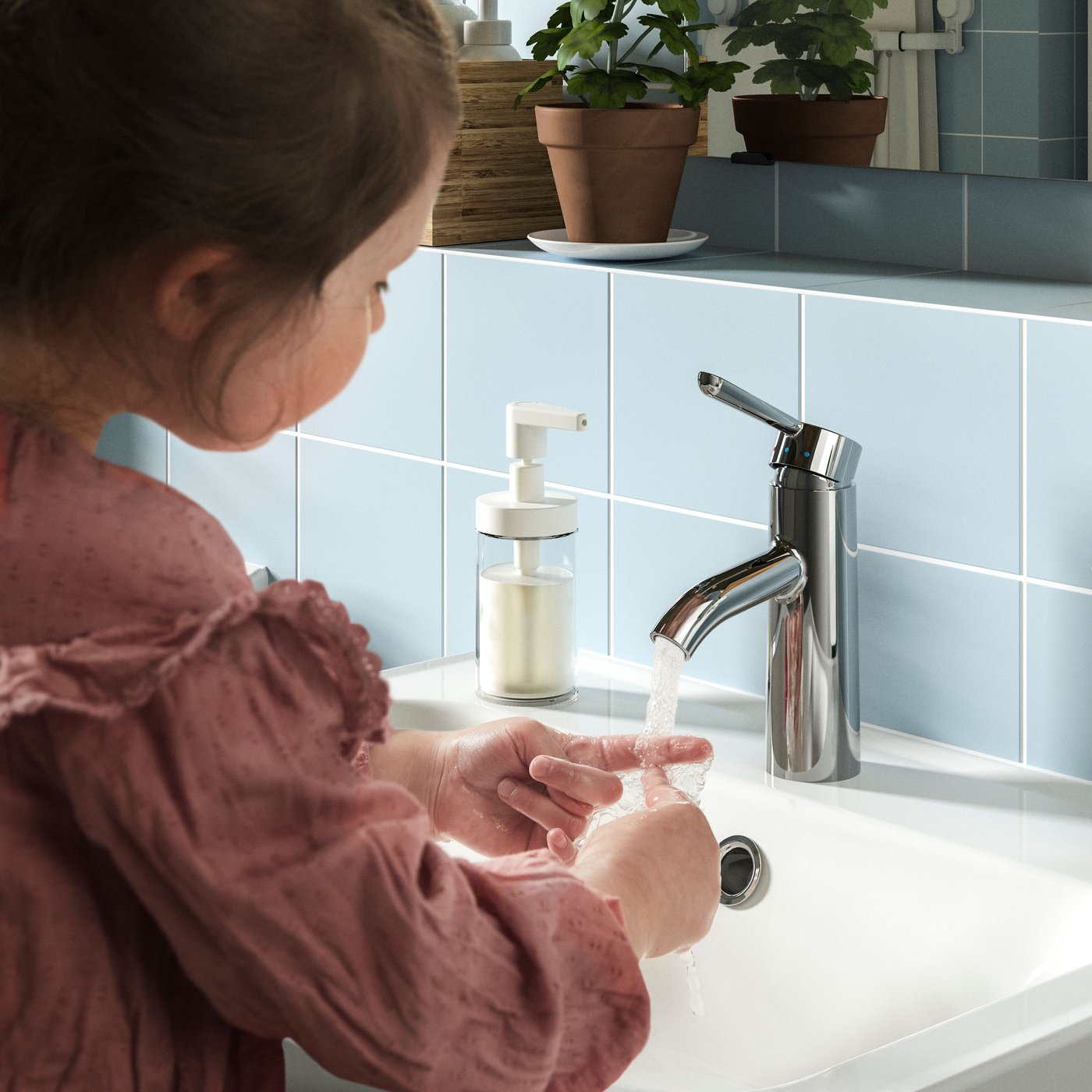 A chrome-plated DALSKÄR wash-basin mixer tap in the bathroom