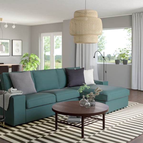 A Kelinge grey-turquoise KIVIK 3-seat sofa with chaise longue in the living room