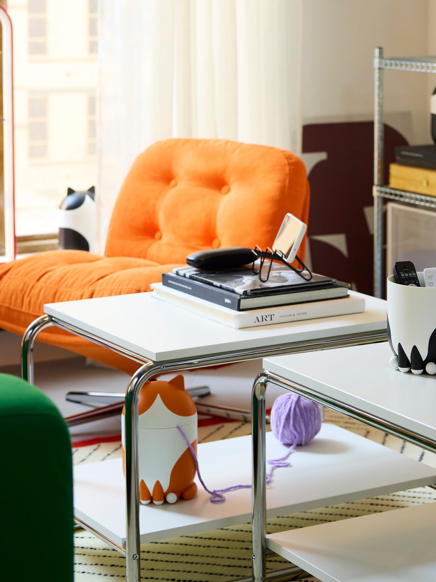 A white BAGGBODA side table in the living room