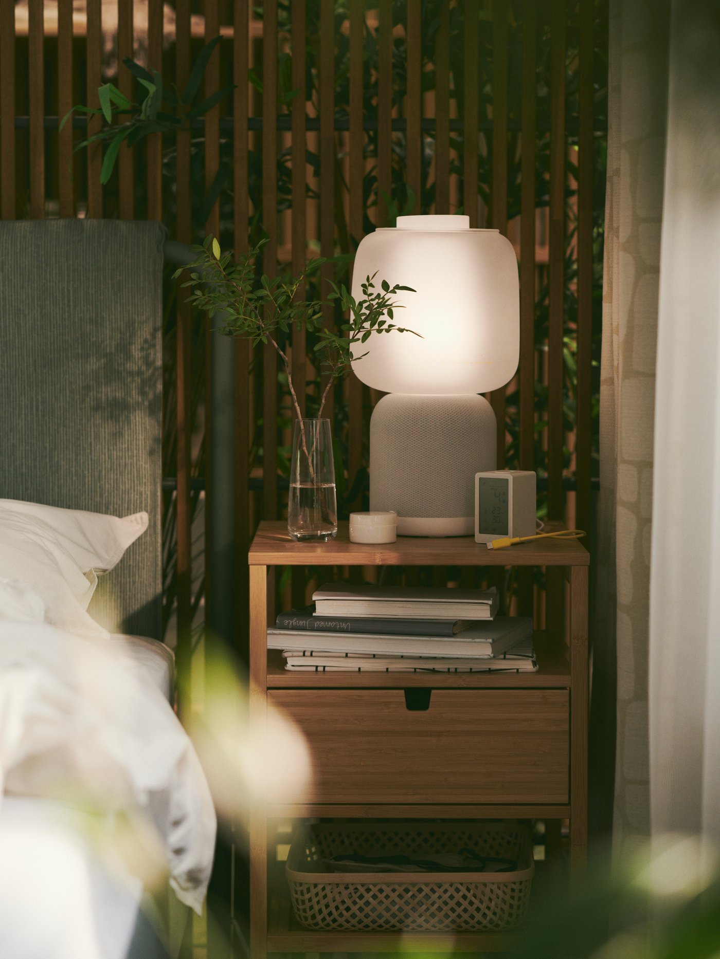 A bamboo NORDKISA bedside table in the bedroom
