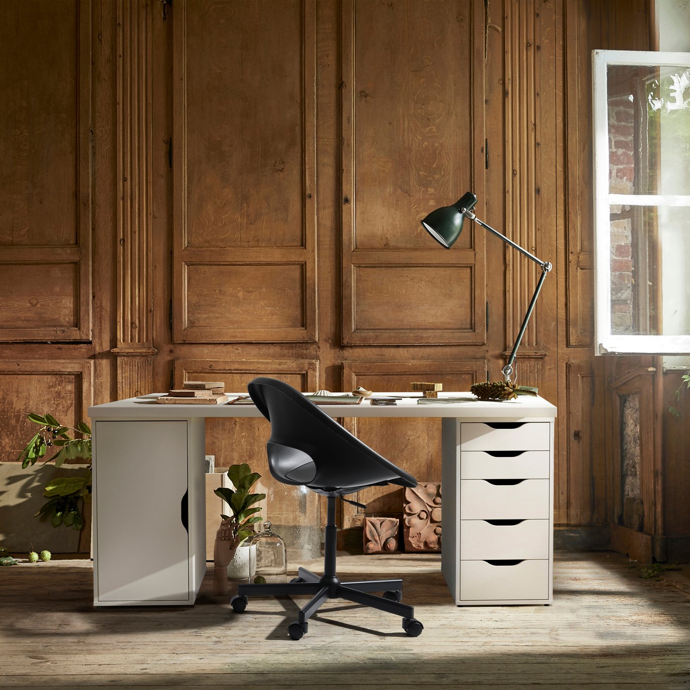 White LAGKAPTEN/ALEX desk in a home office with decorative wooden walls.
