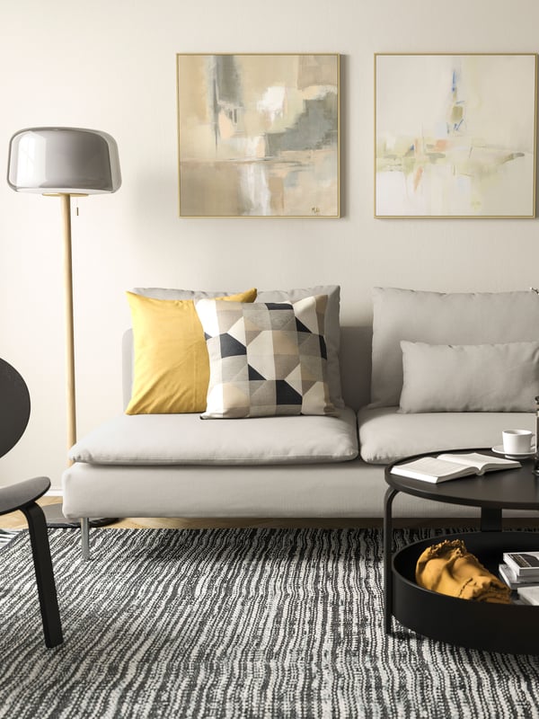 A golden-brown SANELA cushion cover in the living room