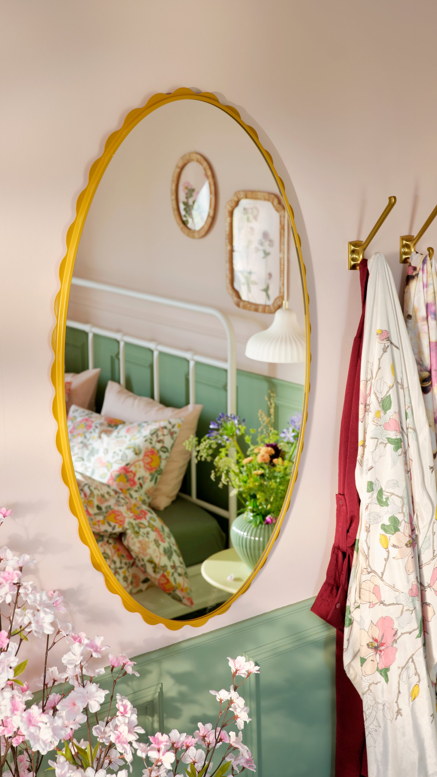 A dark yellow DAGGKAPRIFOL mirror in the bedroom