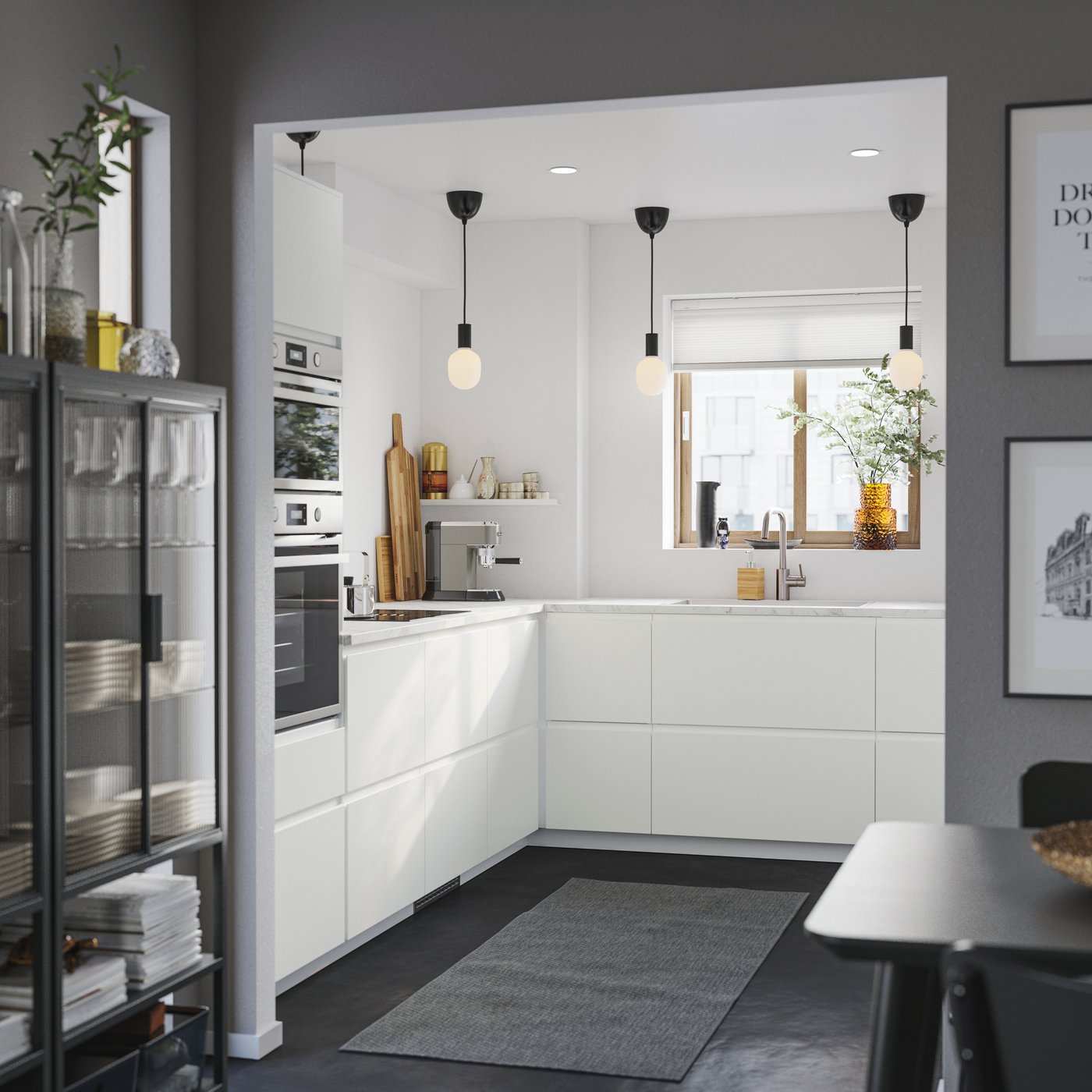 A matt white VOXTORP drawer front in the kitchen