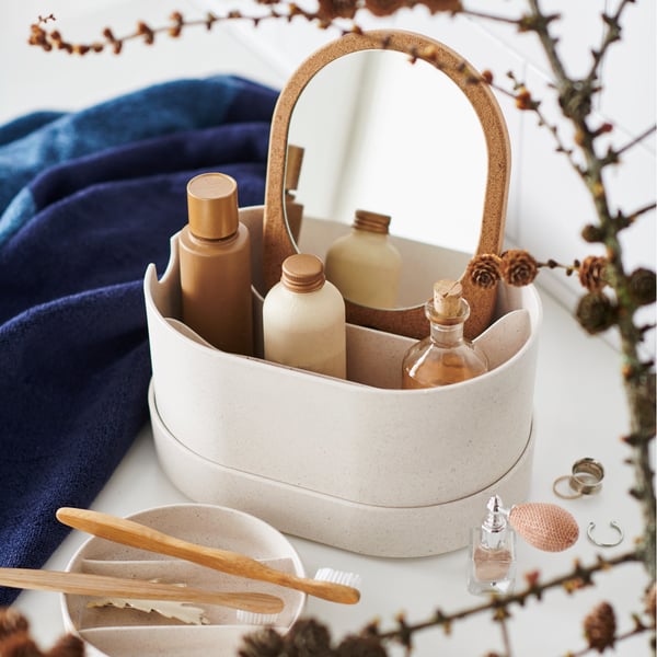 A plastic cork SAXBORGA storage box with mirror lid in the bathroom