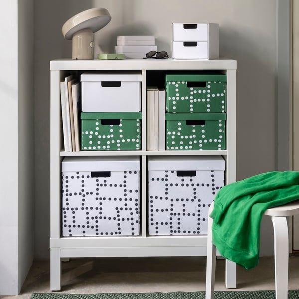 A white/white KALLAX shelving unit with underframe