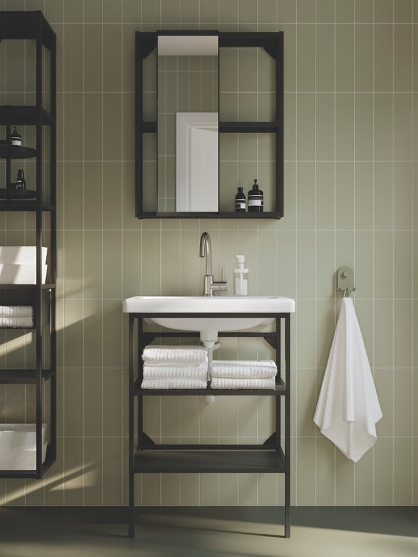 A bathroom has an ENHET open wash-stand with two shelves and legs in anthracite and a TVÄLLEN single wash-basin.