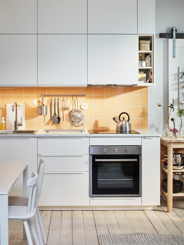 A stainless steel colour ÄLMAREN kitchen mixer tap in the kitchen