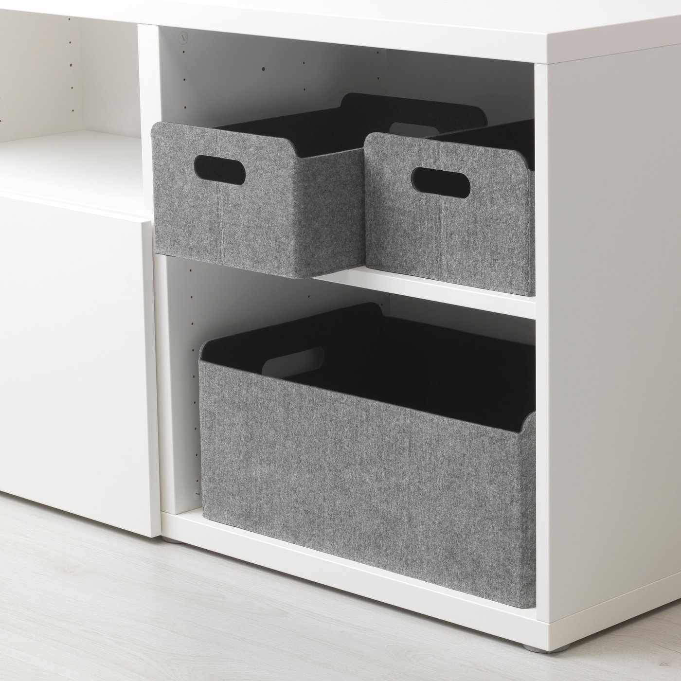 A grey BESTÅ box in the living room
