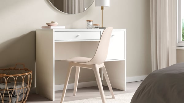 A white SYVDE dressing table in the bedroom