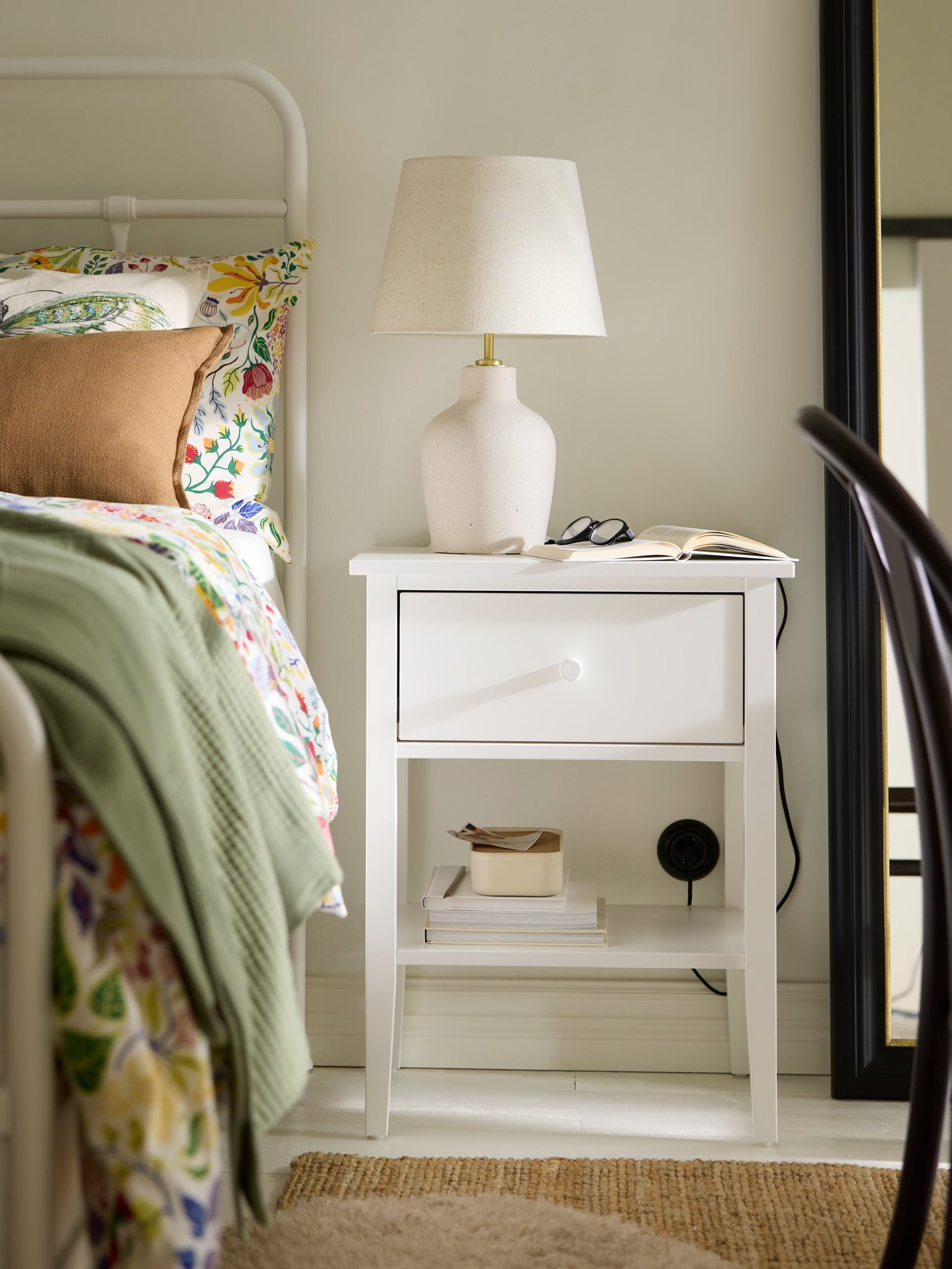 A black ALMARÖD mirror in the bedroom