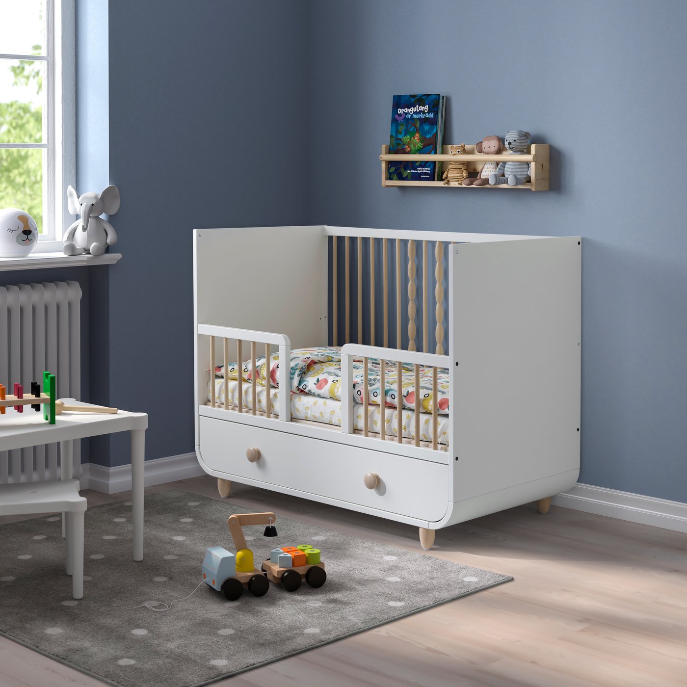 A white MYLLRA Cot with drawer