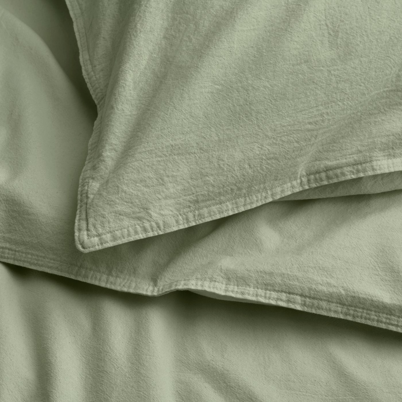 A grey-green ÄNGSLILJA duvet cover and pillowcase