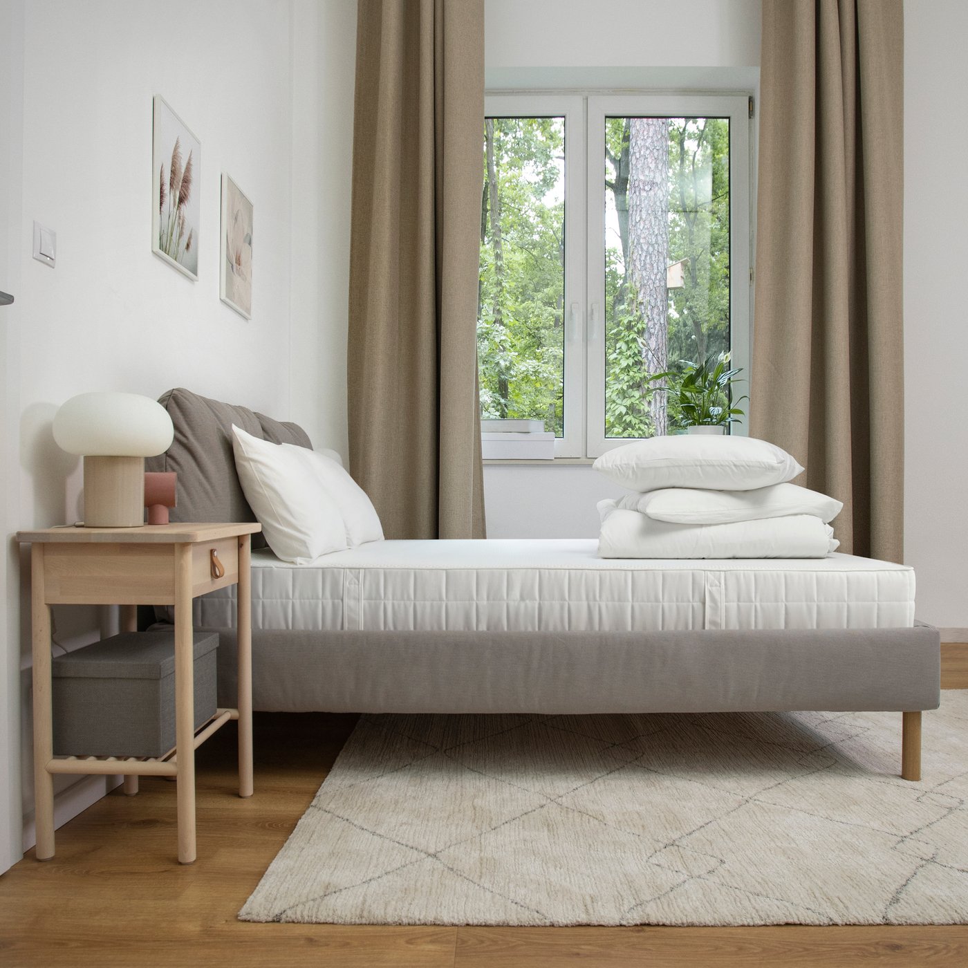 A firm/white VATTAO pocket sprung mattress