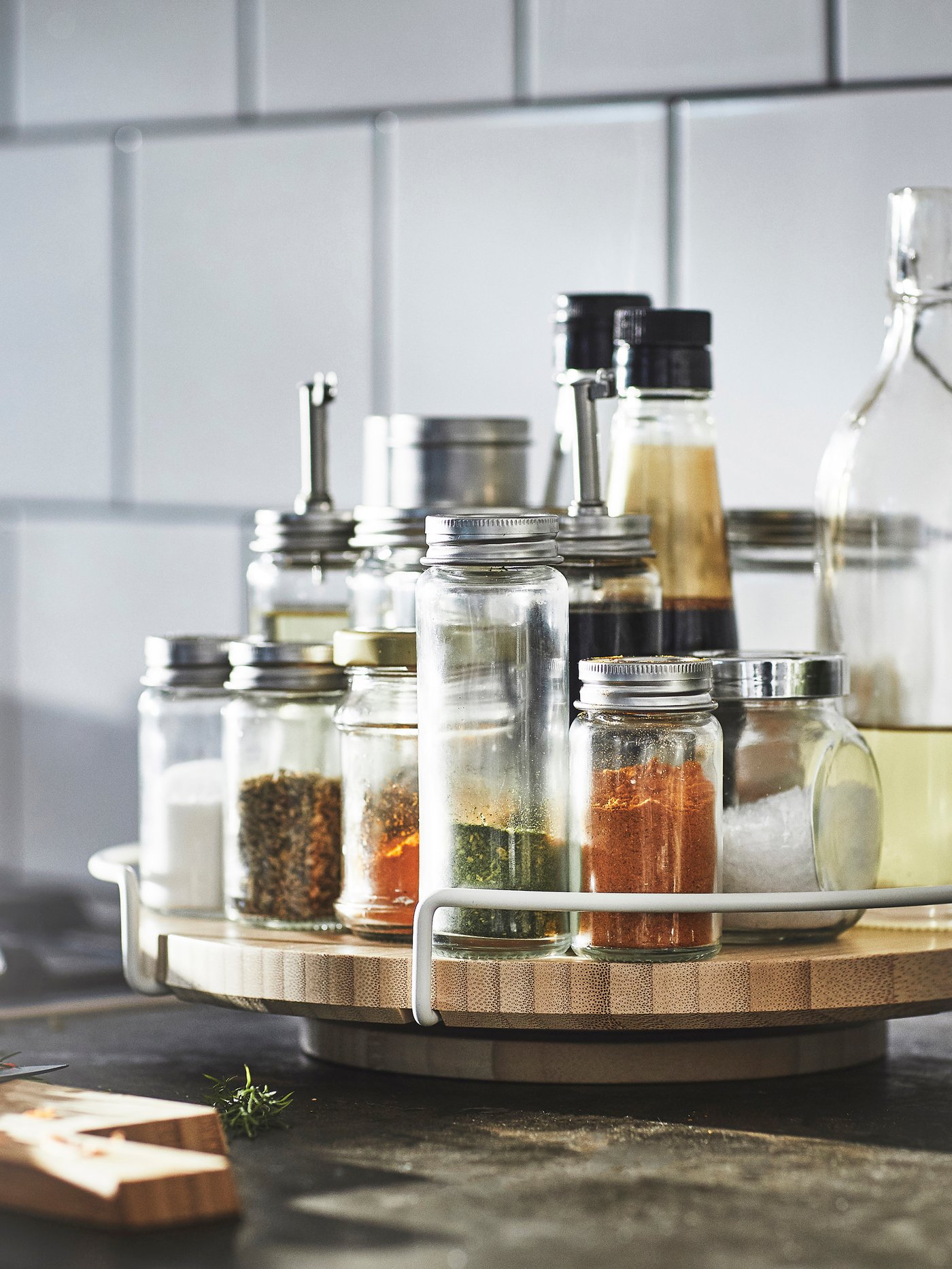 A clear glass/stainless steel CITRONHAJ salt and pepper shakers in the kitchen