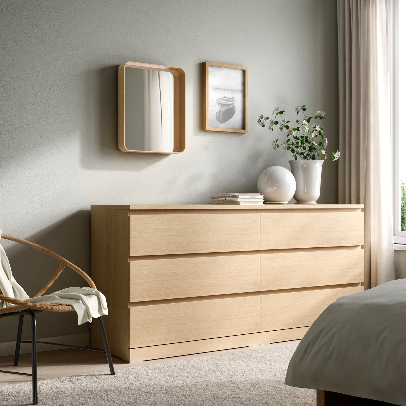 A white stained oak veneer MALM chest of 6 drawers in the bedroom