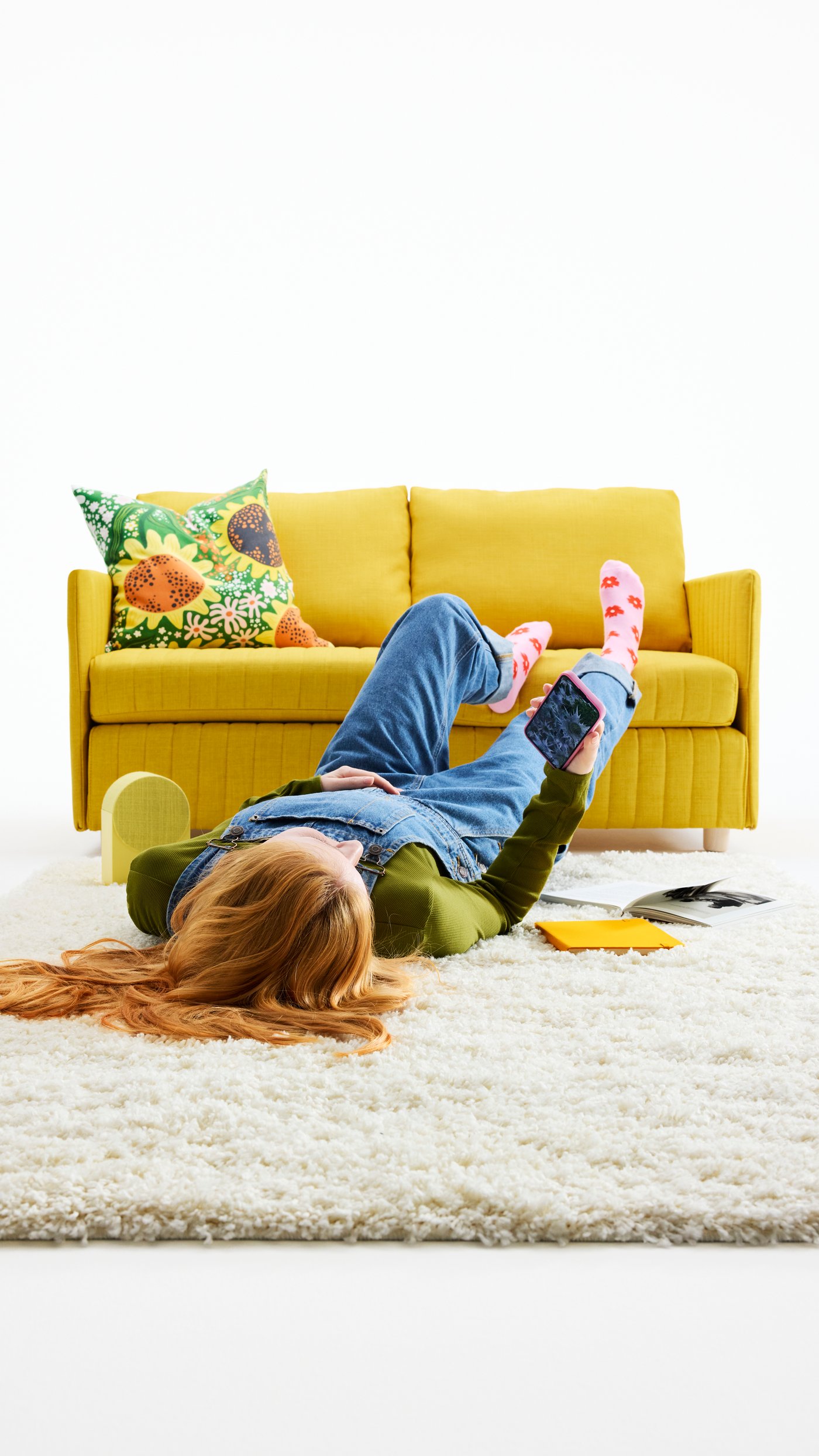 A Skiftebo yellow FRIDHULT sofa-bed in the living room