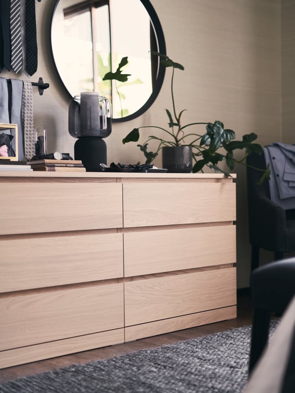 A dark grey LANGESUND mirror