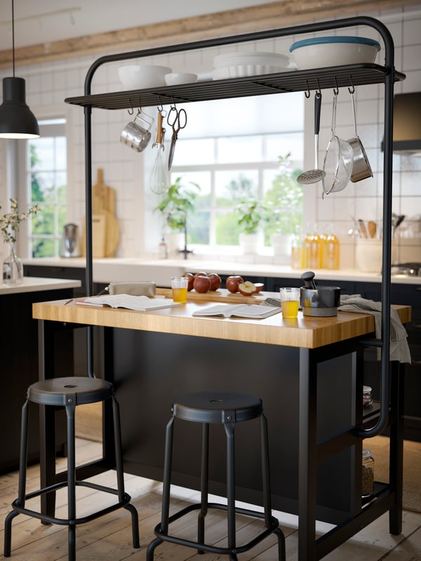 A black RÅSKOG bar stool in the kitchen