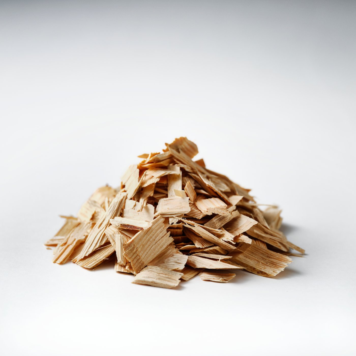Pile of wood chips representing how wood can be reused as a raw material.				