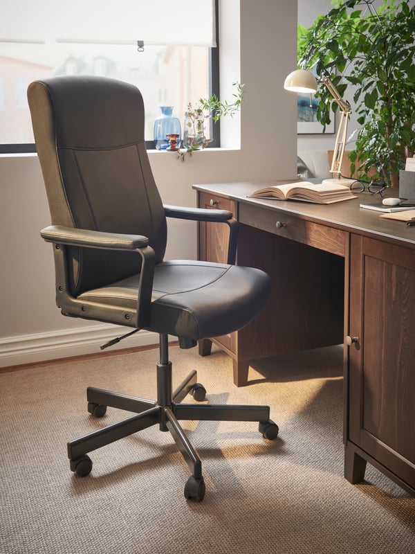 A beige FORSÅ work lamp