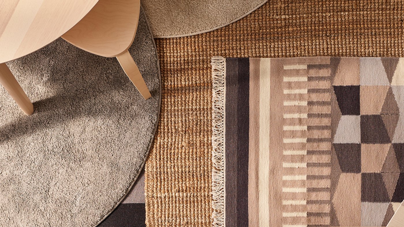 An off-white STOENSE rug, low pile